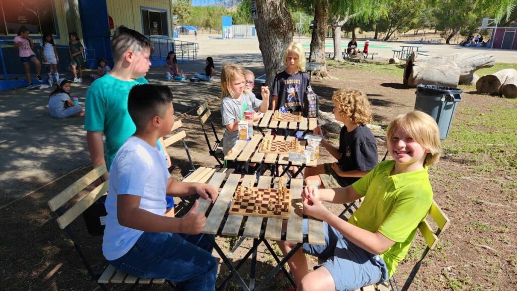 iLEAD Agua Dulce learners chess outdoors