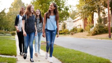 teen-girls-walking-neighborhood