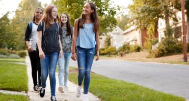teen-girls-walking-neighborhood