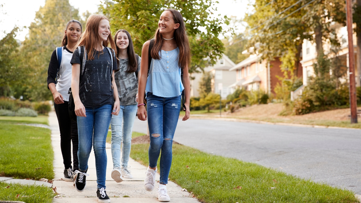 teen-girls-walking-neighborhood